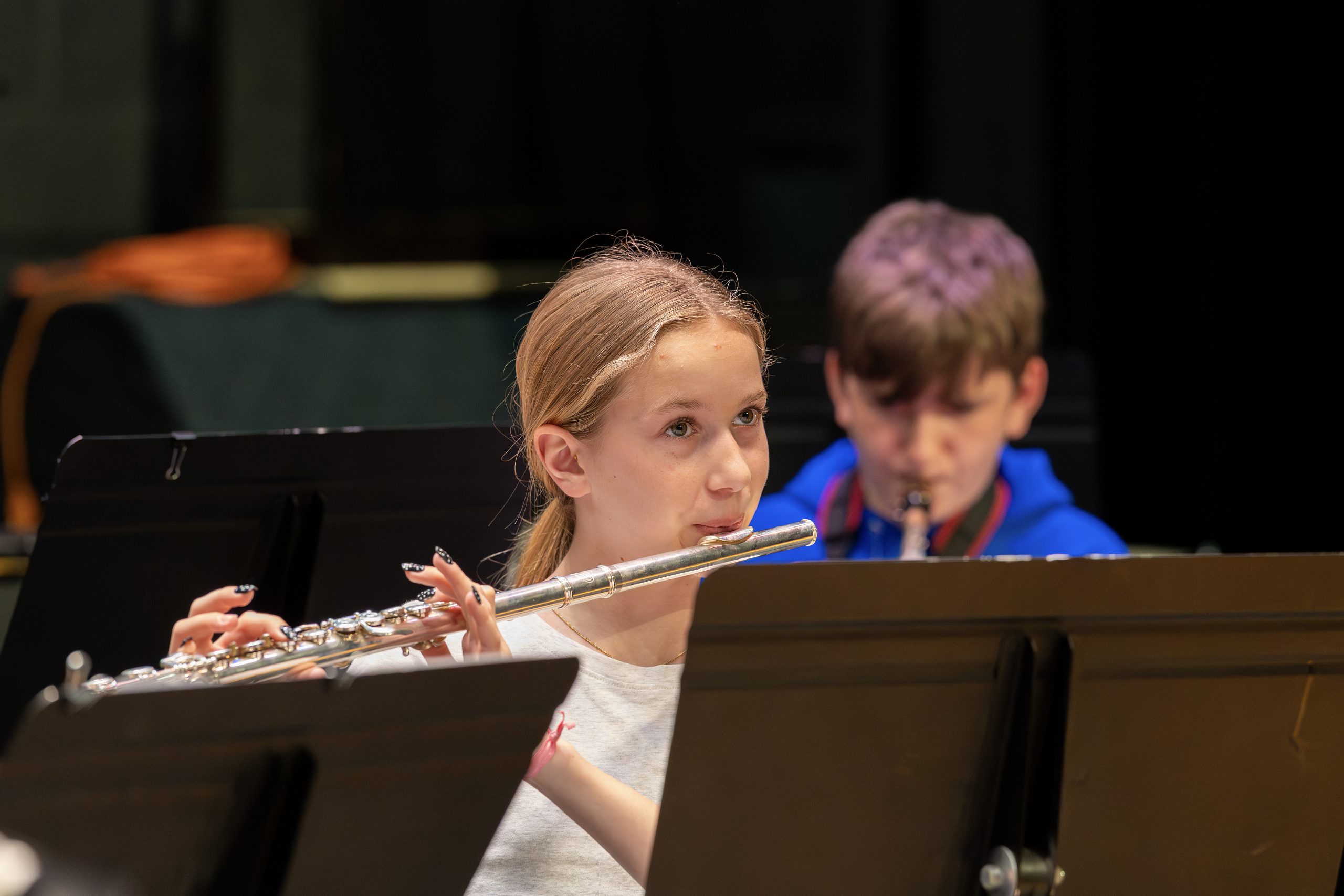 A student plays the flute