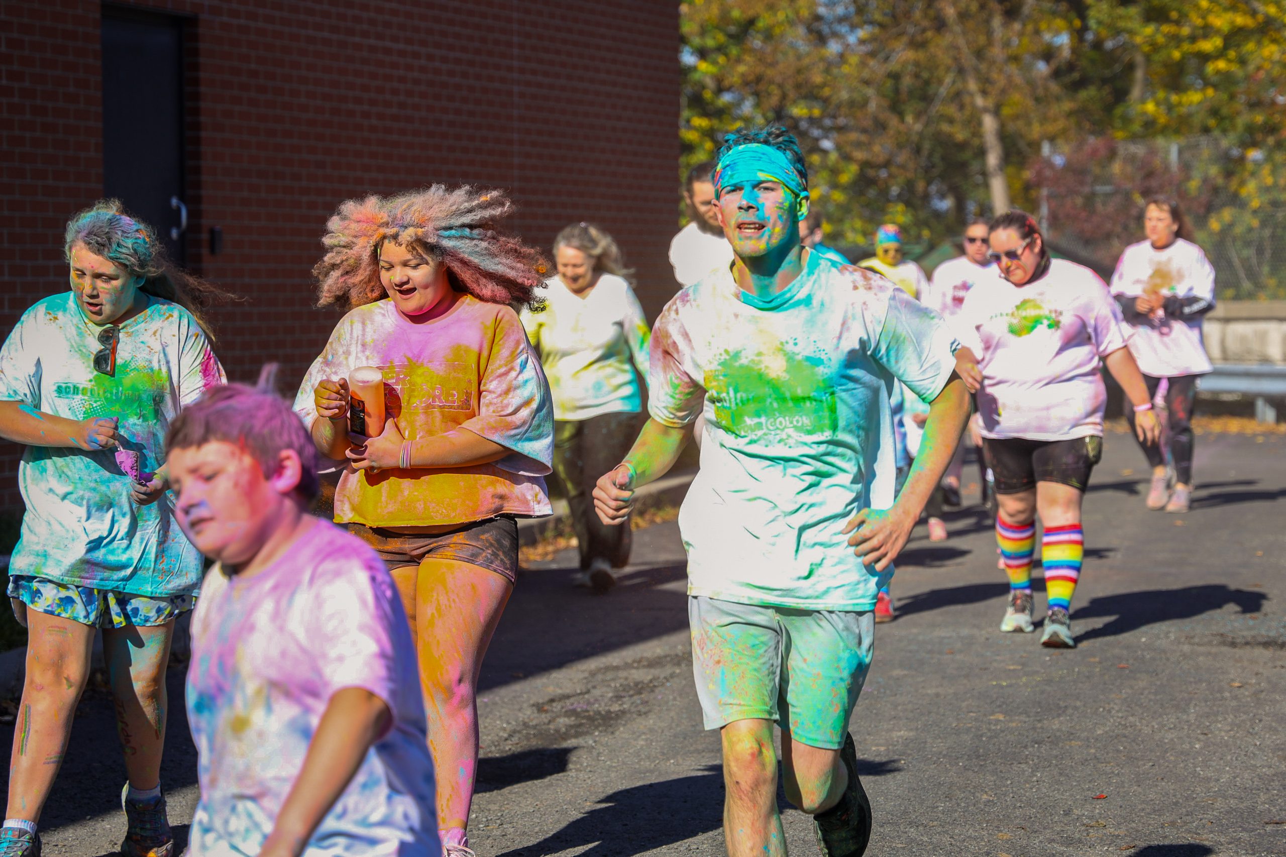 Secondary school students running at the color run