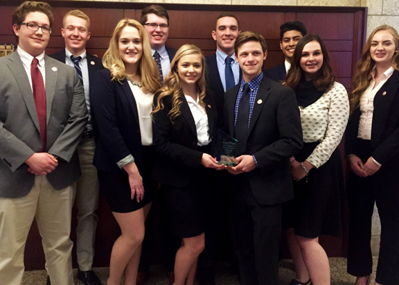 Group of the state champions holding their award. 