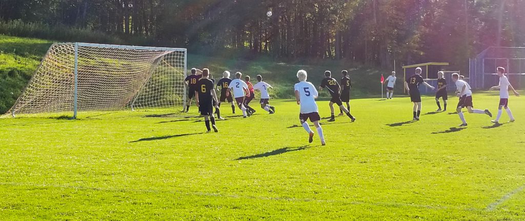 A soccer ball flies through the air as BKW and Canajoharie players vie for it during a sectional soccer game