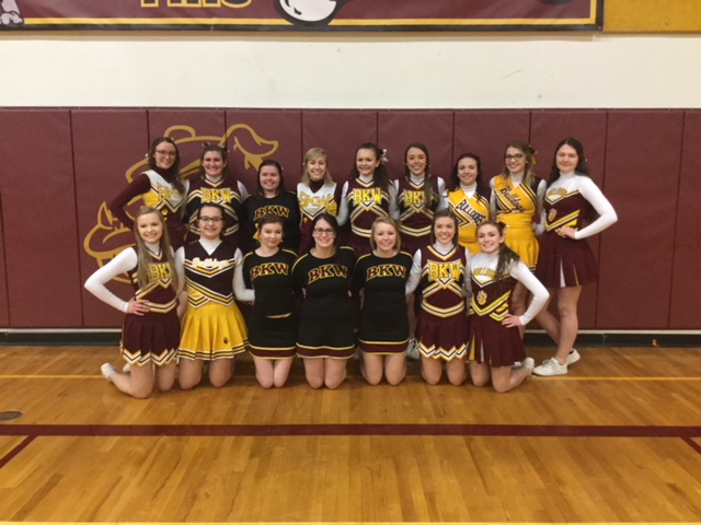 Alumni cheerleaders pose for a picture after the annual Alumni Association Basketball game