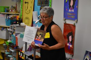 Author Kim Kord reads "Icky Picky Suzie" to an elementary class