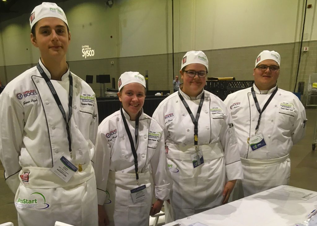 Jovan Afzali (left) of BKW stands with his teammates at the national ProStart Invitational.