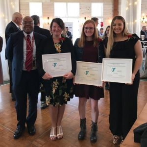 Teacher Katyanna Keyser and students Courtney Sherwin and Morgan Thomas pose with Secondary School principal Dr. Mark Pitterson during the Capital District YMCA Outstanding Student and Educator Awards