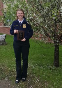 Kayleigh Reynolds-Flynn poses with her plaque after placing first at the New York state FFA convention
