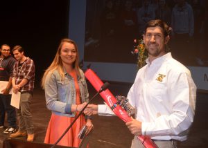 Taylor Vincent accepts the Golden Hammer Award at a CTE ceremony