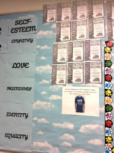 Individual pledges on a wall committing to stopping bullying