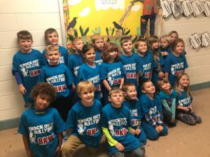 about 20 students wearing blue anti-bullying t-shirts