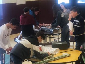 students wrapping boxes