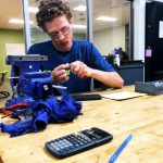 student works on a machine