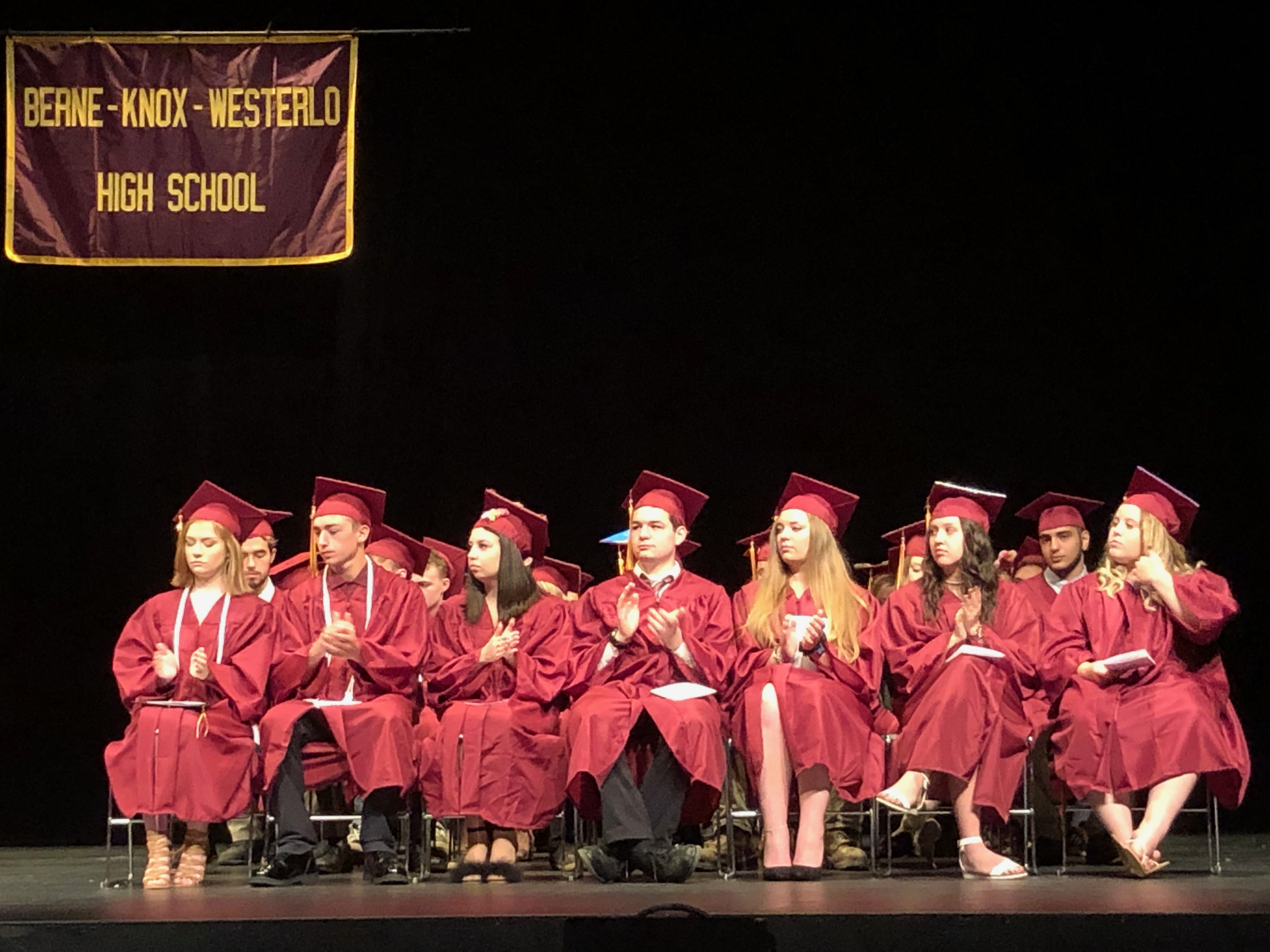group of graduates on stage