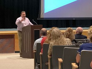 Matthew Tedeschi speaks in auditorium