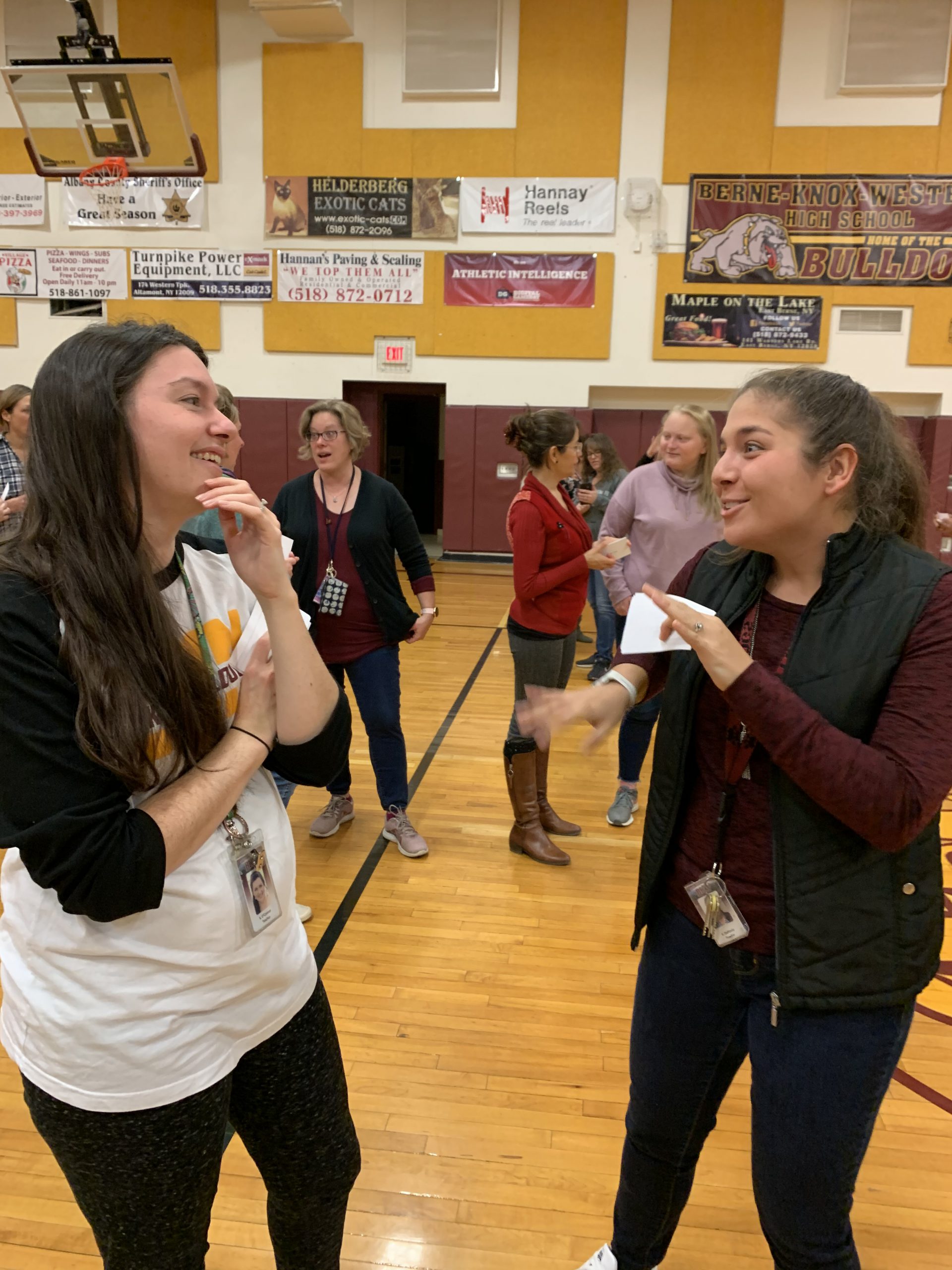 staff members mingle in the gym
