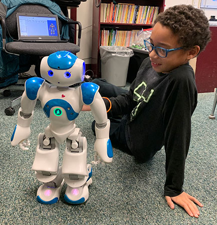 Natasha the robot with student