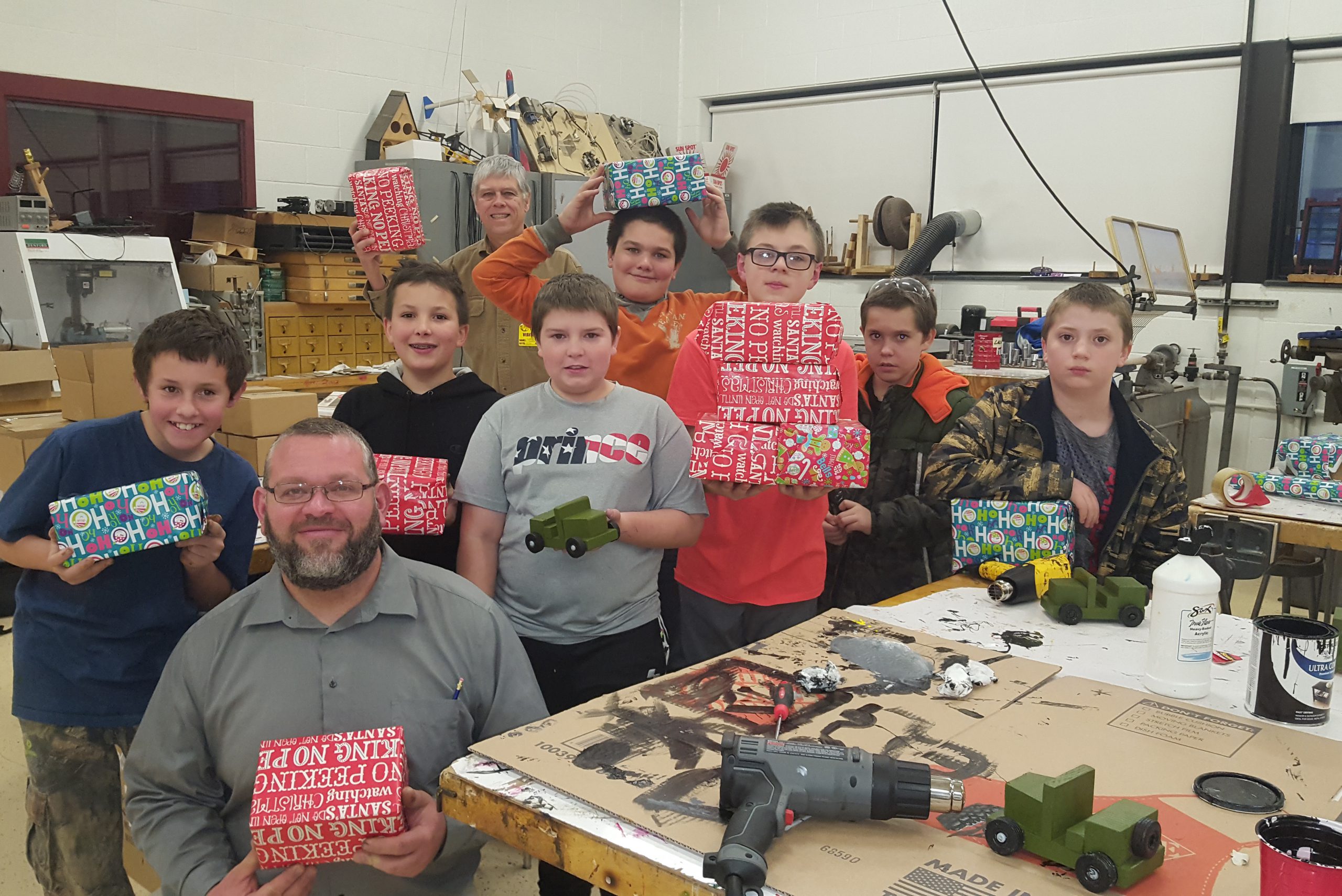 group of students and their instructors who off the toy Jeeps they built
