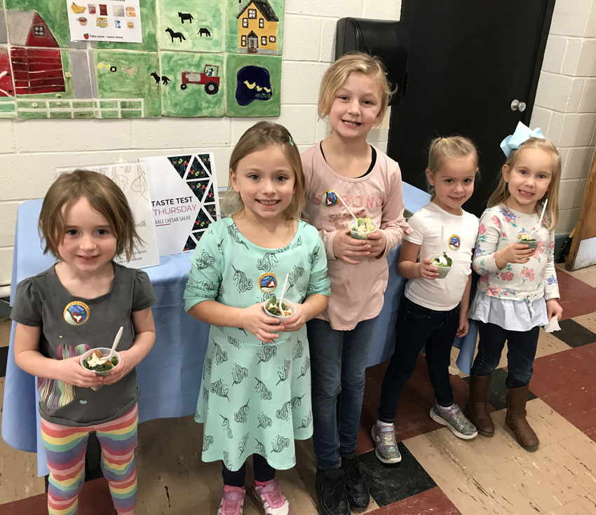 five girls taste testing kale