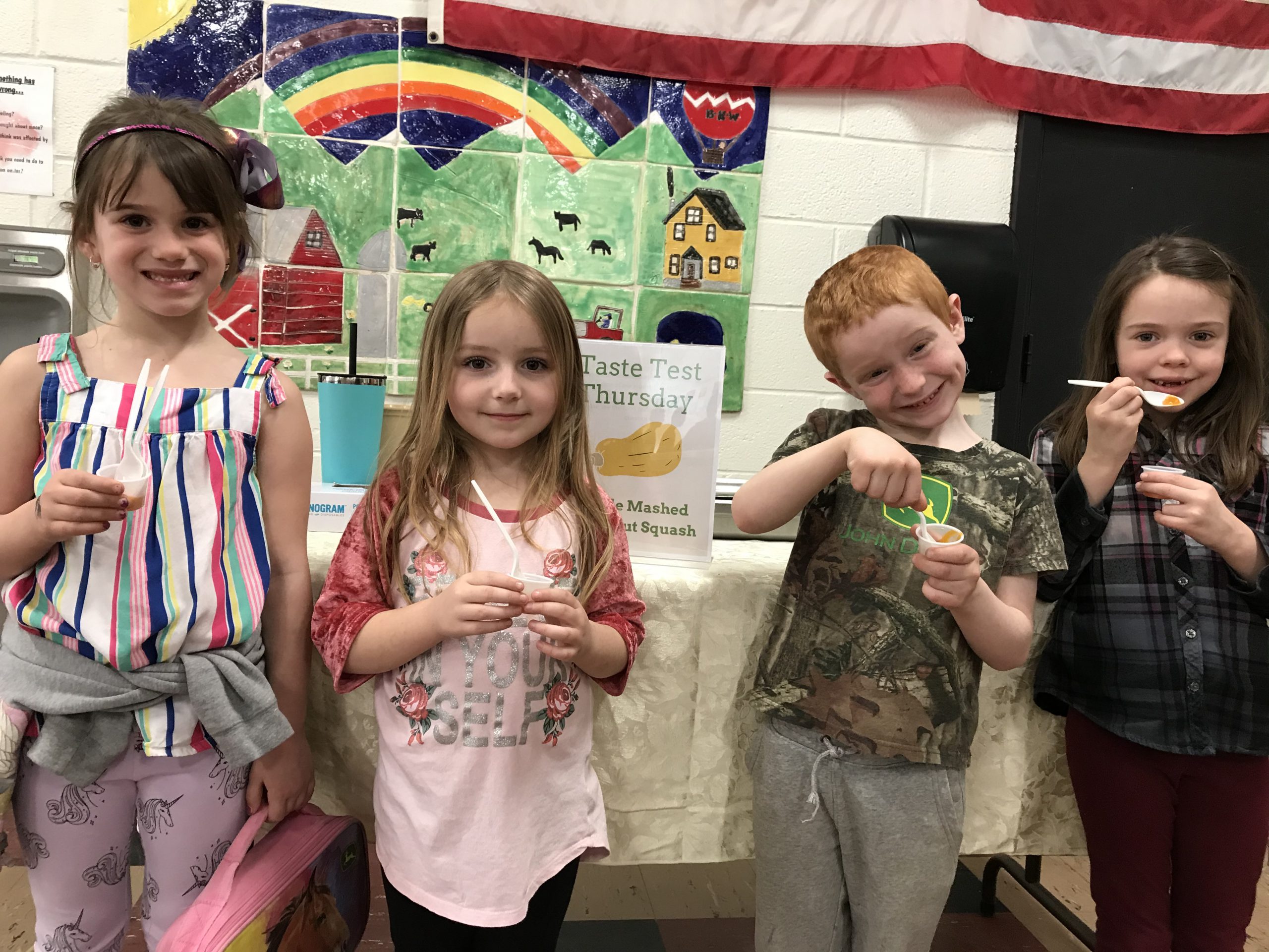 four kids enjoy squash