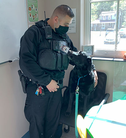 Maggie checks Deputy Stone's ID badge