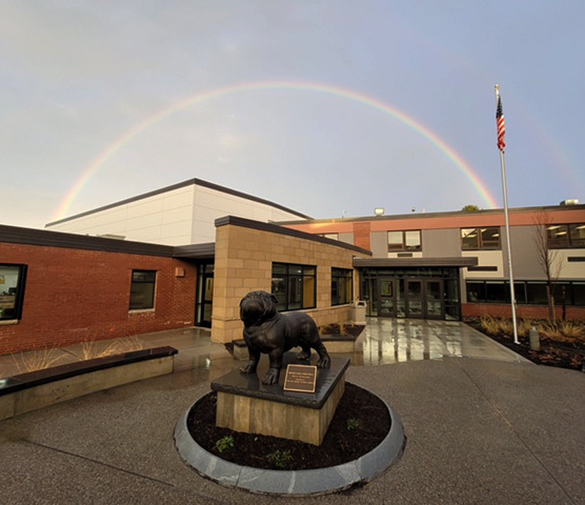 Rainbow over bulldog and secondary school entrance photo by Andy Wright