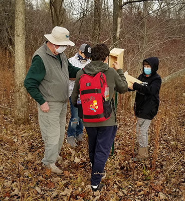 Kiwanis Club and students put up bird house