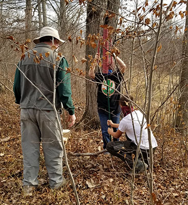 Kiwanis and students put up bird house along trail