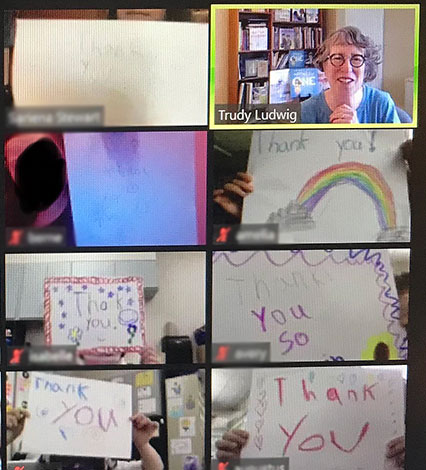 computer screens showing thank you signs and Trudy Ludwig's face