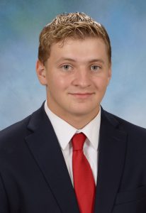 boy in blue suit and red tie