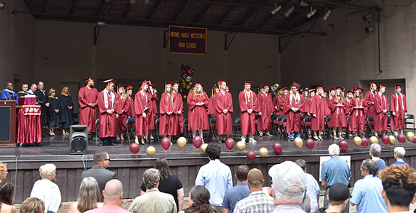 graduates on stage