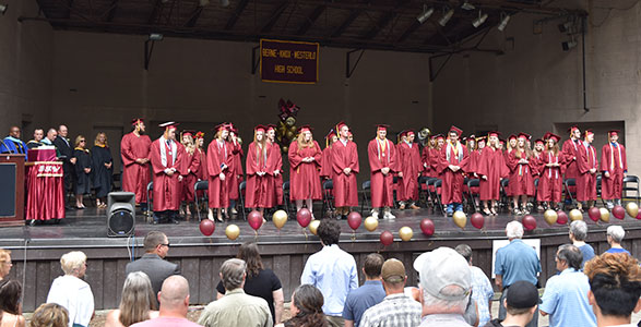 graduates on stage