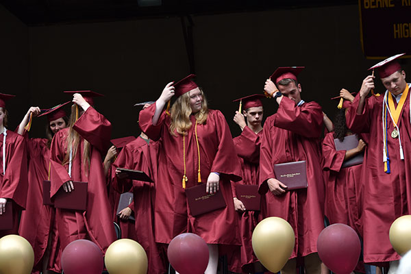 graduates move their tassels