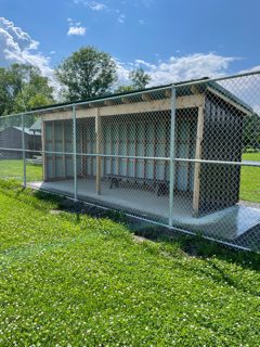 dugout with fence surrounding it