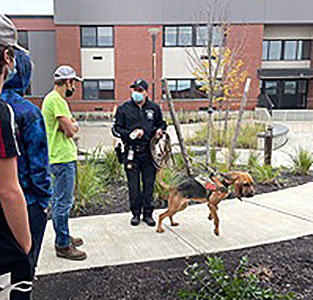 Deputy Stone and Casey outside the school