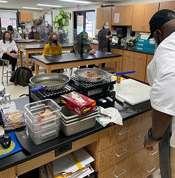 Lateef Clark at front of classroom