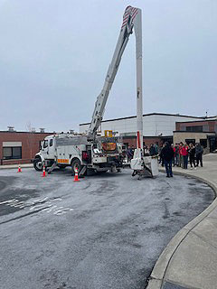 students watch National Grid demo outside their school