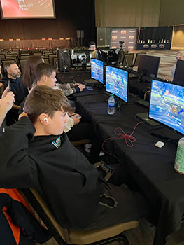 students sitting at computers in convention center