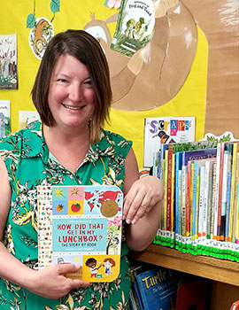 Katy Keyser holding a book