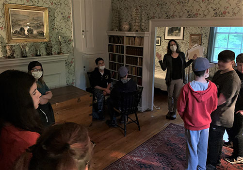 students in a group listening to a presentation