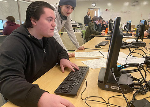 Matthew in class at computer