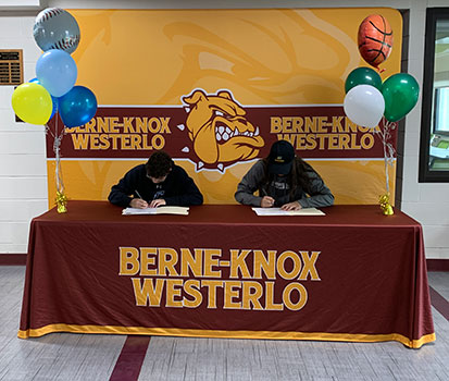 Jacob and Alexis signing their letters