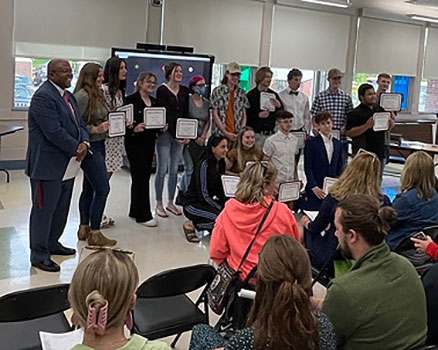 students with Dr. Pitterson at board meeting