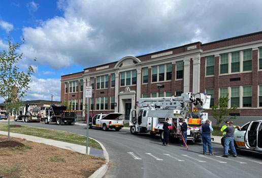 utility trucks line bus loop