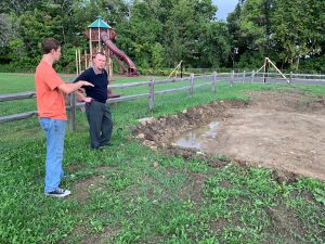 BKW senior Aaron Carr discussing the initial layout for the outdoor classroom space with Superintendent of Schools Dr. Mundell. The project was supported by a grant from the Albany County Soil and Water Conservation District. Mr. Carr worked on the concrete foundation for the outdoor space.