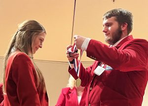 BKW senior Allyson Bates receiving her SkillsUSA first-place medal for Cosmetology on March 16.