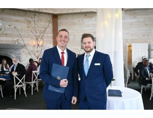 Mr. Dergosits (pictured left) after receiving his Albany County proclamation at the Capital Region YMCA Student and Educator Breakfast on Tuesday, March 25.