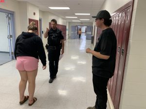 Albany County Sheriff's Deputy Hughes shows high school seniors the roadside tests that are conducted to identify impaired driving. 