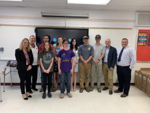 Dr. Placke posting with district administrators and students at the completion of his visit to the BKW campus.