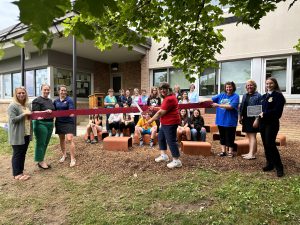 BKW staff and students awaiting Mrs. Tambasco to cut the ribbon on the new outdoor learning space on the elementary campus.
