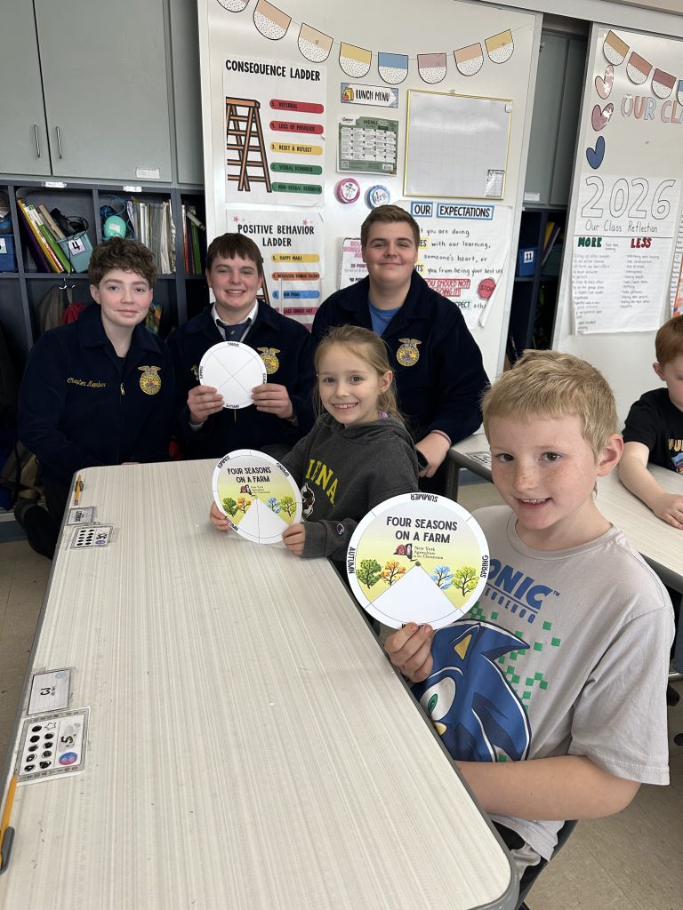Fourth-grade Students learning from their secondary school friends during Ag Literacy Week.