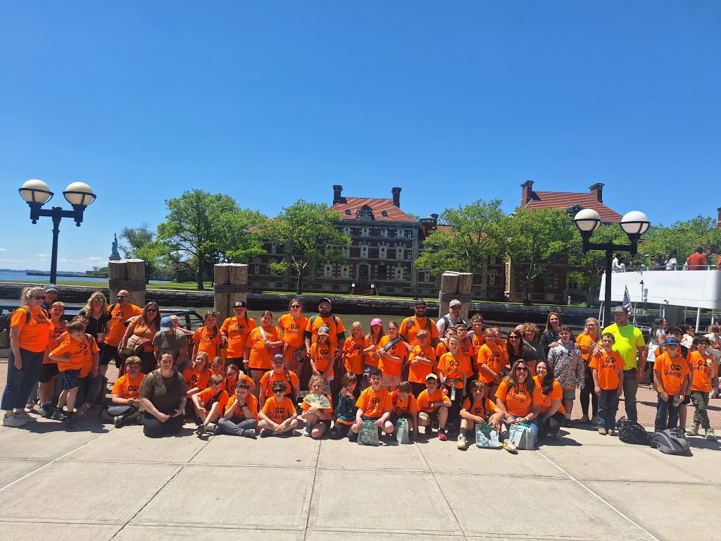 Fourth grade students posed on Ellis Island